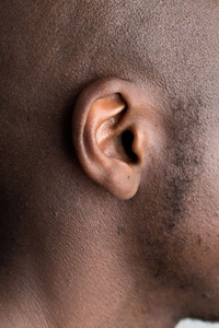 Profile of a man’s face that shows his ear